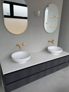 Gold taps that were installed in a bathroom for a customer in Perth